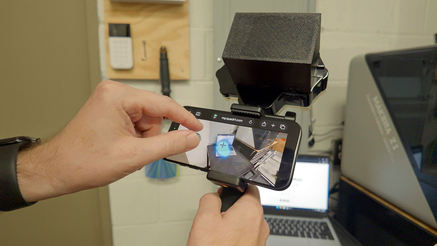 QuadRF showing augmented reality WiFi signal overlay on laptop